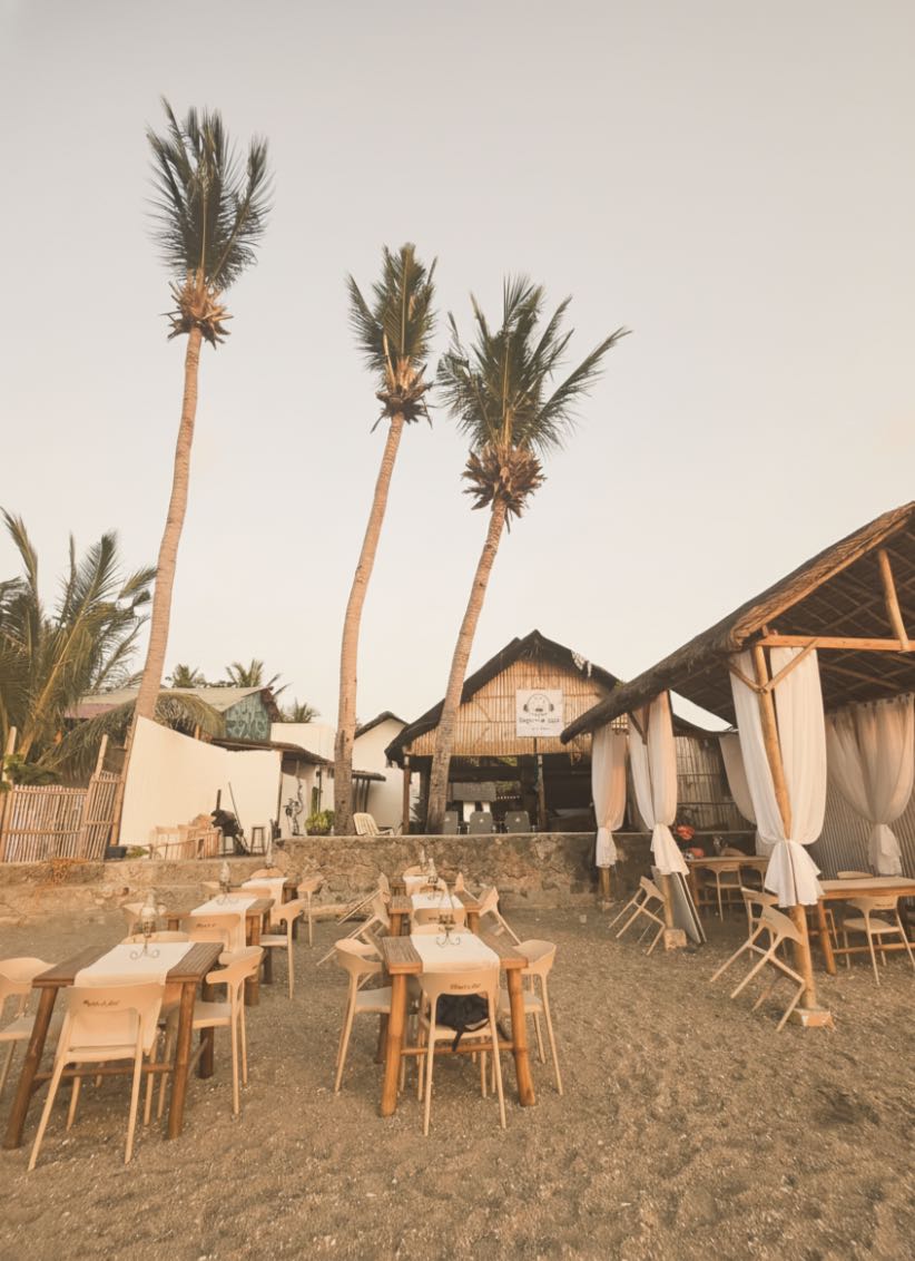 Open-air Reef Kitchen restaurant with ocean views